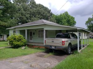 Corner lot with a 3 bedroom home at a great price. This home offers a nice size chain link fenced yard, carport and more. Home needs a little TLC. Call to see before this one is gone.