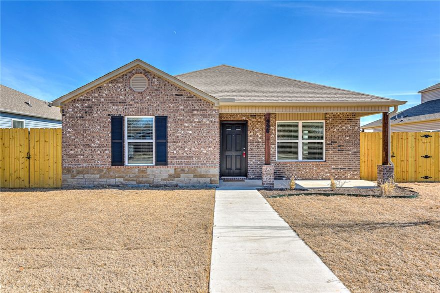 Step into this stunning rental home, where charm meets modern comfort! A welcoming covered front porch and beautifully landscaped yard set the perfect first impression. Inside, an open-concept floor plan flows effortlessly through 3 spacious bedrooms and 2 sparkling bathrooms. The bright, crisp white kitchen features energy-efficient appliances and plenty of counter space, ideal for whipping up meals or entertaining. Enjoy casual breakfasts in the cozy nook or host memorable dinners in the elegant dining area. Relax in the generous living room or step outside to the inviting back porch—perfect for gatherings or quiet evenings under the stars. Washer, dryer, and refrigerator included. Schedule your tour today and make this exceptional home yours!