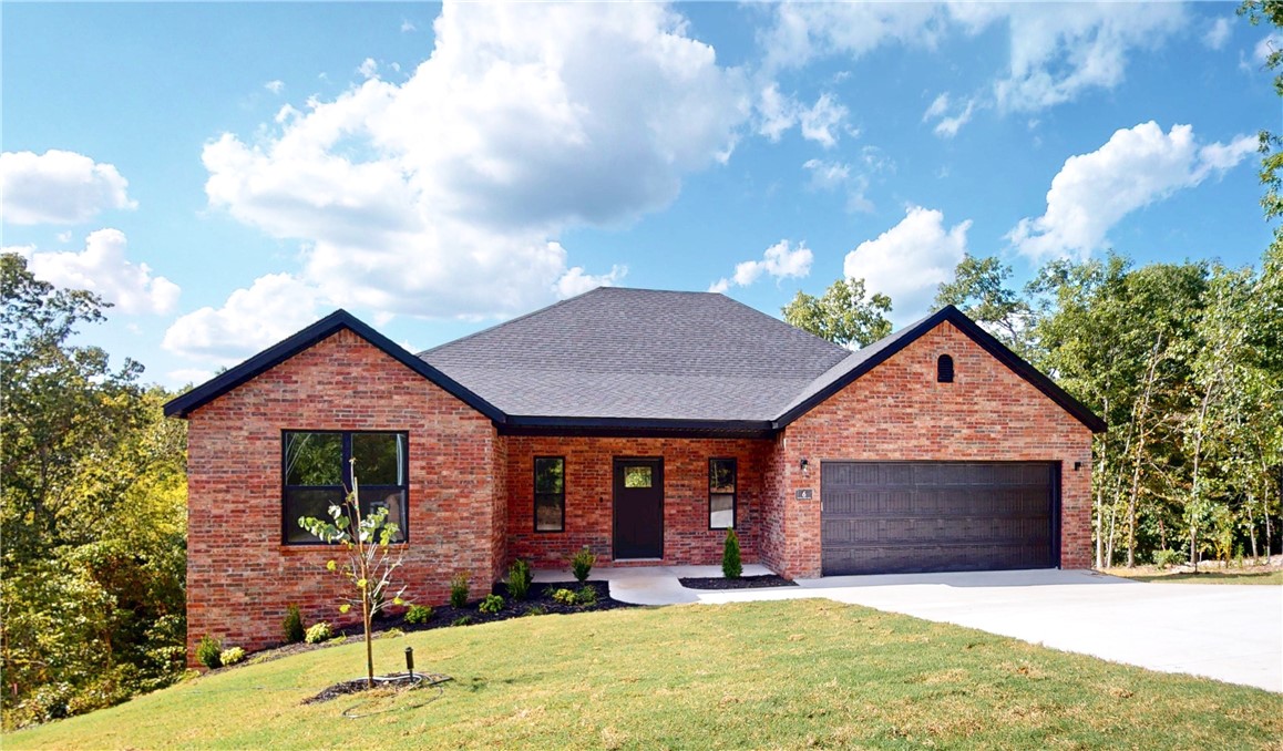 Tucked into a quiet cul-de-sac, new 4-bed, 2-bath home offers clean lines, natural light, & wooded serenityāno septic worriesāon city sewer. Inside, enjoy an open layout with soaring ceilings & durable LVP flooring. The kitchen features granite countertops & an island, SS appliances, & a walk-in pantry. Gas fireplace adds warmth to living areaāthe 4th bedroom flexes easily as office/creative space. Out back, an elevated deck overlooks a gently sloping yardāideal for play, pets, or peaceful evenings. Bonus: Bentonville schools, water recirculation system, 2-year builder warranty, & $10,000 closing costs/upgrades. Minutes from bike trail, Back 40, & close to 7 golf courses. 16 Burwell blends privacy, convenience, & long-term value. Act today & take the next step into your new chapter. Photos are from another similar Iron Gate new construction with the same plan, some finishes are different.