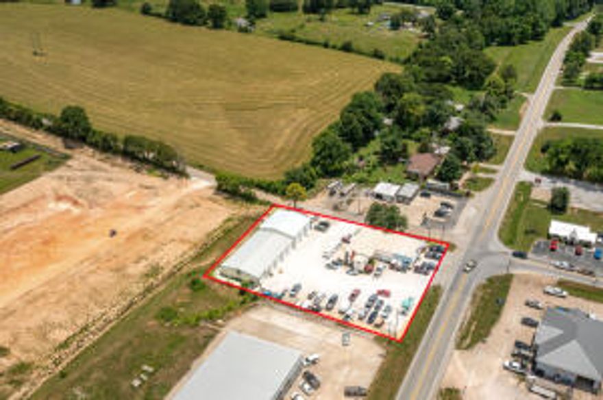 Excellent Commercial Location. Located at the intersection of Hwy 7 N & Hwy 43 E, 165 fee of Hwy 7 Road Frontage. 1,000 sq ft of Showroom, 1,456 sq ft Apartment with 1,236 unfinished Basement, plus a 50' x 143' Shop Building with 8 Overhead Doors. Selling Real Estate Only.
