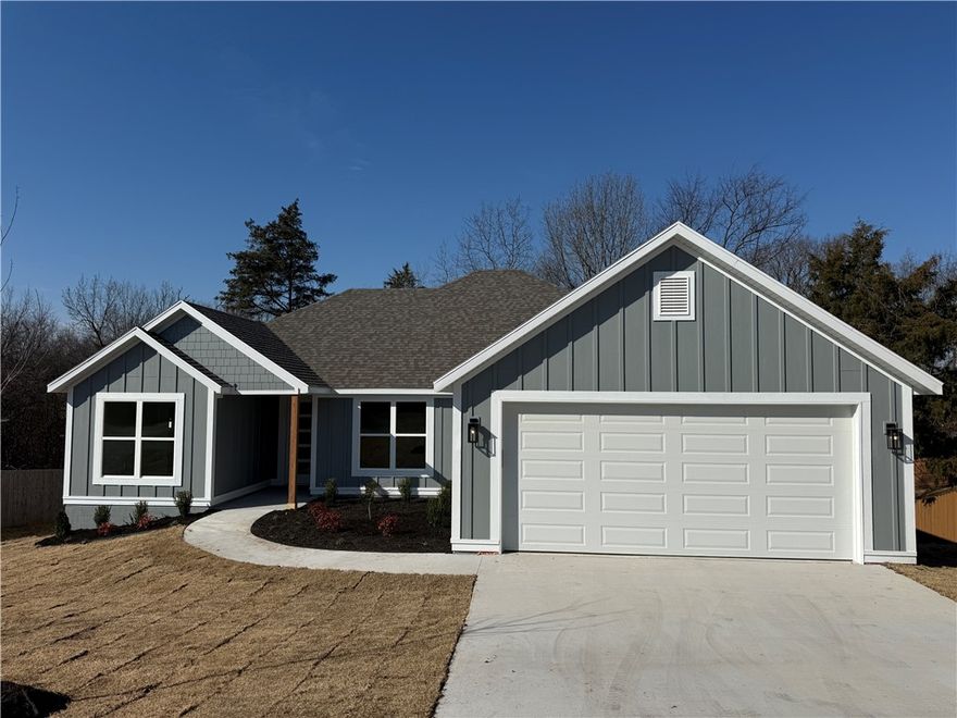 This thoughtfully designed home offers an open-concept, split floor plan with vaulted ceilings in the living room and primary suite for an airy, spacious feel. The living and dining areas feature built-in cabinets, floating shelves, and a floating mantle over the electric fireplace. Expansive 6’x9’ windows in the living, dining, and primary rooms fill the space with natural light. The exterior showcases painted Hardie Plank on the front and low-maintenance vinyl on the other sides.

The kitchen includes a hidden pantry, and the laundry room provides a sink plus lockers with cubbies for added storage. Enjoy the versatile back deck—half covered, half open—overlooking a gently sloping yard that levels out into a large common area lined with mature trees. This sewered lot preserves trees at the back of the lot. Act fast and pick some of the remaining finishes. 

This home has solar board for a 40° cooler attic, exterior sheathing is Zip System which creates a tighter envelope, and insulation is blown fiberglass.
