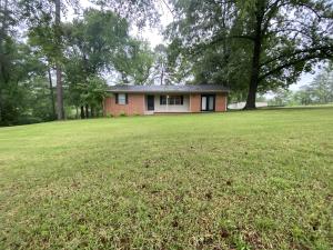 Perfect starter home nestled on 2.24 acres with 3 bedrooms, 1 bathroom and just under 1600 sq ft. Relax on your covered back patio during the cool summer nights. Store the lawn mower and all the kids outside toys in the large storage shed.
