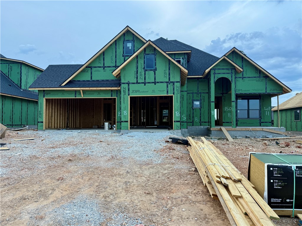 Welcome to Hillcrest in Cave Springs!Enjoy peaceful surroundings on the edge of town with the convenience of being just minutes from everything NWA has to offer. The Eagle Plan offers 2,835 square feet of thoughtfully designed living space, featuring 5 bedrooms and 3 full bathrooms. On the main level, you'll find an inviting open-concept layout that seamlessly connects the living, dining, and kitchen areas. Conveniently located just off the three-car garage, the mudroom and utility room offer practical everyday functionality and flow directly into the spacious primary suite. This smart split-floor layout ensures the primary suite remains a private retreat, separate from the rest of the main-floor living spaces.Also on the first floor is a secondary bedroom and a full bathroom.Upstairs, three additional bedrooms share a full bathroom.Outside, a covered back patio with a cozy fireplace creates a perfect space to enjoy the outdoors in comfort, all year long.