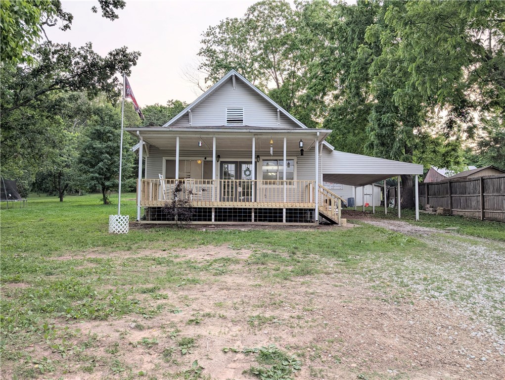 If you have been searching for a beautiful 4-bedroom, 2-bathroom home outside the city, situated on just under an acre of land with no restrictions, take a look at this property. This home features a new front porch, an updated master bathroom, a bonus work office, spacious bedrooms, and tile flooring, all at a price that is hard to find for a property of this size. Be sure to come and see if this home meets your needs! Please note that both bathrooms are actively being remodeled. Pictures will be posted as soon as they are ready.