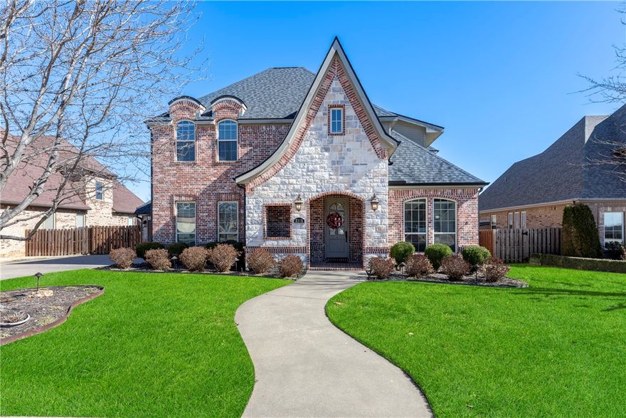 Welcome to Turnberry at the Peaks, located just off I-49 near The Promenade for easy access to all Northwest Arkansas has to offer - shopping, dining and entertainment at your fingertips.   This 3,535 sqft 2-level home has it all!  On the main floor you'll find the primary suite, a great room with gas log fireplace for gathering, the well-appointed kitchen, a formal dining room, a private office, a 1/2 bath for guests and the utility room.  Upstairs, find a bonus room, and 4 secondary bedrooms - connected in pairs by 2 shared full baths.  Impressive interior spaces throughout with 10' ceilings, crown moldings and trims, solid wood doors and built-ins.  Hard surface flooring in living/kitchen/hallways/baths; carpeted bedrooms & closets.  Kitchen is outfitted with stainless steel appliances, dual ovens, gas cooktop, granite countertops and a walk-in pantry.  Outside, find the patio with gas log fireplace - perfect for a quiet cup of coffee, a lively dinner party or anything in between.