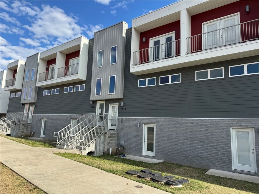 Gorgeous townhome nestled in a highly desirable Fayetteville location—right next to Baum Stadium and just minutes from the University of Arkansas campus! This spacious and thoughtfully designed 3-bedroom, 3.5-bath home offers the perfect blend of style, comfort, and convenience. Step inside to an inviting open-concept layout featuring beautiful hardwood floors, stainless steel appliances, and sleek granite countertops. Modern smart-home upgrades—including keyless entry and a smart thermostat—make everyday living easy and efficient. Additional highlights include a rare two-car garage—ideal for parking, storage, or game-day gear. Whether you're headed to class, catching a Razorbacks game, or enjoying Fayetteville’s vibrant lifestyle, this home puts it all within reach.