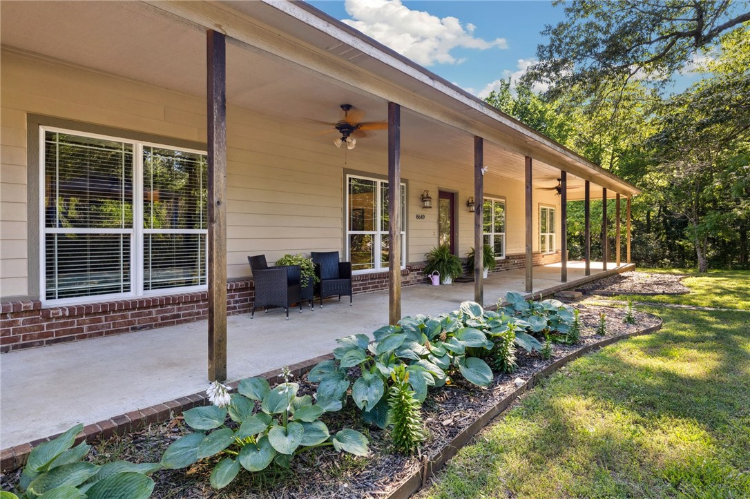 Welcome to your private retreat in West Fayetteville! Nestled on a secluded, fully fenced 4-acre lot, this stunning 4 bed, 2 bath home offers peaceful country living just minutes from town. Built in 2006, the home features spacious living areas, a dedicated office, mud room, and an attached 2-car garage. Enjoy the serenity of your very own pond, a picturesque koi fish pond with a waterfall, and a gated entrance for added privacy. Relax or entertain on the expansive covered front and back porches, or grill under the charming pergola. Kids will love the custom A-frame playhouse, and hobbyists will appreciate two outbuildings/shops ready to finish into your dream workspace or car storage. Whether you're enjoying morning coffee by the water, hosting gatherings under the stars, or exploring your creative side in the shop, this property delivers the perfect blend of comfort, functionality, and outdoor beauty. A rare opportunity to own a piece of paradise in Fayetteville!