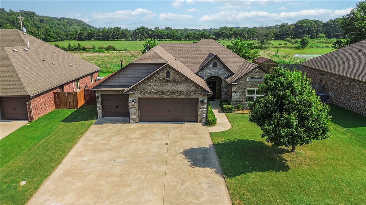 Donāt miss your chance to own this stunning all-brick 4 bed, 2 bath gem in charming Cave Springs! Located in the highly rated Bentonville School District and just 8 minutes from XNA Airport, this home combines convenience and charm. Enjoy quick access to trails, parks, Wal-Mart AMP, Rogers Promenade, Crystal Bridges, and endless dining options. Nestled in a quiet neighborhood, it features a spacious 3-car garage with epoxy floors, a large pantry, and a laundry room connected to the master closet. The expansive yard is perfect for relaxing or entertaining. Walk to the creek for summer fun or hit the nearby Creeks Golf Course. Downtown Cave Springsāwith its cozy coffee shop and small-town vibeāis just 2 minutes away. Schedule your tour todayāthis beauty wonāt last!