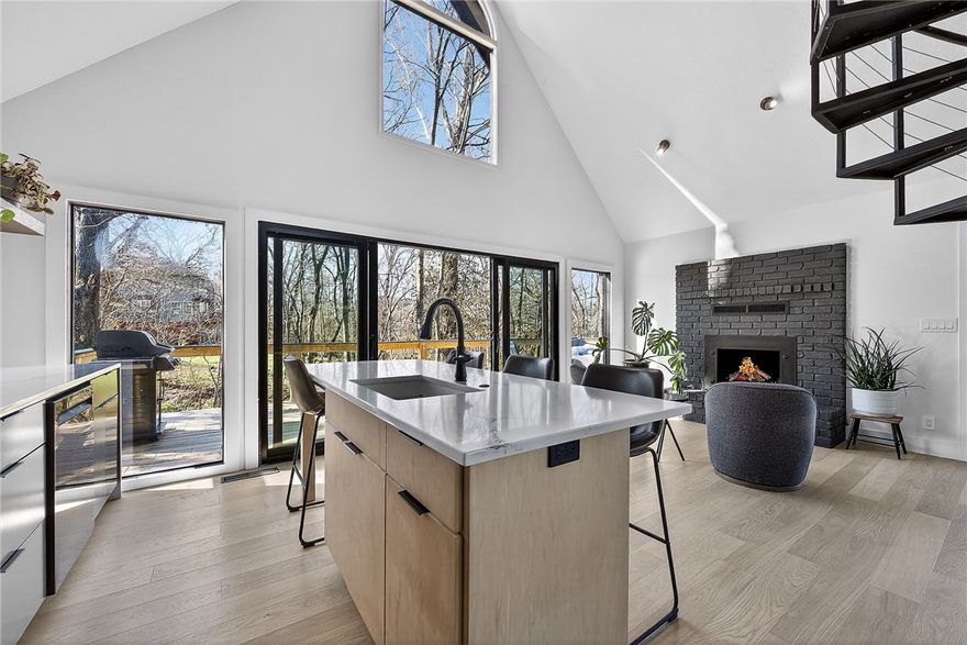 Rare and unique opportunity just steps from the Coler Mountain Bike Preserve South Gateway! Situated on nearly half an acre and only 200 yards from one of Bentonville’s most iconic trail systems, this fully updated home is a dream for investors, outdoor enthusiasts, or anyone wanting to live in the heart of the Mountain Bike Capital of the World. Completely renovated inside and out, updates include new cement siding, Pella windows and Pella 12 ft quad door with 6 ft opening, luxury vinyl plank flooring, and a stunning wrap-around deck overlooking a peaceful wooded setting. The kitchen features quartz countertops and premium KitchenAid appliances, while the spa-inspired bathroom showcases a Schluter shower system with heated floors in both the shower and bathroom. A custom spiral staircase adds a striking architectural element, and a tankless water heater provides modern efficiency. Priced well below recent appraised value, this property offers an exceptional opportunity!