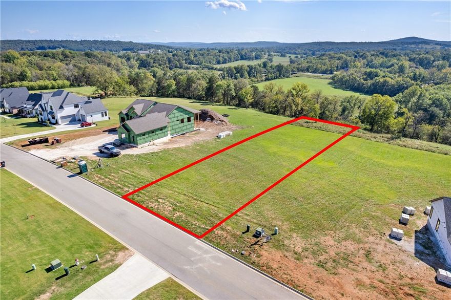 Perched on a gentle rise with panoramic vistas, this vacant lot offers a rare opportunity to build your dream home with sweeping views of hills, treetops, and open skies. Ideally suited for a walk-out or one-level home, this lot is surrounded by million-dollar-plus residences and features an elevation designed to capture abundant natural light and open views. Convenience is excellent — you're minutes from parks, trails, shopping, dining, and cultural amenities that enrich daily living. Whether you envision a serene retreat or an architectural showpiece, this parcel provides the canvas. Utilities are available, access is straightforward, and a future home here will truly feel elevated in every sense.