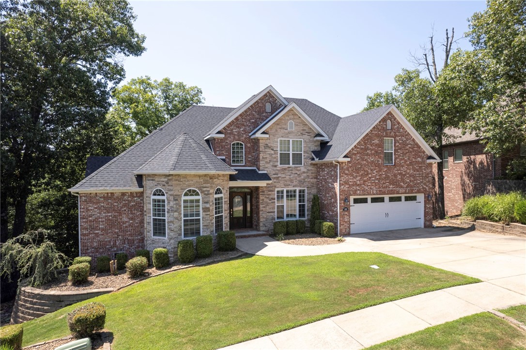 Step into luxury and serenity with this exceptional property nestled in sought-after Kensington subdivision in Bentonville. This 3-level home, 6 bedrooms, 5 Bathrooms is a perfect retreat for your family. Situated in a serene, wooded setting, this home offers privacy while being conveniently close to I49 & DTB. The living room boasts breathtaking treetop views, vaulted ceiling, grand fireplace, making it the ideal space for relaxation and entertainment. The large eat-in kitchen is a chef's dream, offering the same picturesque views and flows onto the deck, creating an inviting space for outdoor dining. The walk-out basement can easily transform into a fully equipped in-law suite complete with a kitchen, bedroom, bathroom, media room/game room, office, and workshop/storage area. The versatility of this home is truly exceptional. The deck with 3 outdoor living spaces has been newly stained and renovated, and LED lights added for your outdoor activities. Your Dream Home Awaits! Schedule your private tour today!