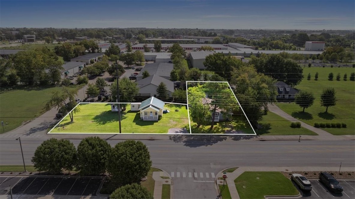Unique Investment Opportunity with Commercial Potential! Whether you’re looking to expand your rental portfolio or explore redevelopment, this property delivers options. With both homes ready for occupancy or updates, it’s an excellent chance to generate steady rental income right away. These two parcels are located directly on the Greenway and in Bentonville's Regional Center hub consisting of smaller businesses like restaurants, office and other services. Also good for concentrated housing in close proximity to abundant jobs. Delivering the cities highest financial performance.
This property features two separate homes on spacious parcels a prime location. The first home offers 3 bedrooms, 1 bathroom, and 1,298 sq. ft. on a .23-acre lot, while the second includes 2 bedrooms, 1 bathroom, and 624 sq. ft. on .34 acres.
From rental investment to long-term growth potential, this property is full of promise in one of the area’s most strategic locations. Also selling 1203 separately MLS Number: 1321369