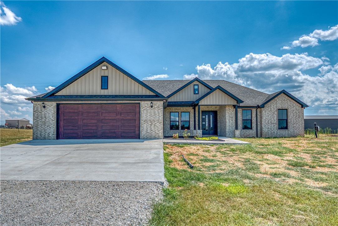 Welcome to this beautiful 4-bedroom, 2-bath home, thoughtfully designed with quality craftsmanship and unique architectural elements throughout. Enjoy open-plan living spaces with soaring 10-foot ceiling, creating an airy and inviting atmosphere perfect for entertaining or relaxing with family. The heart of the home is a gorgeous kitchen featuring luxurious quartz countertops, a convenient pot filler, and high end modern fixtures. Natural light floods the living areas, highlighting the fireplace and seamless flow to the covered back porch-complete with an outdoor kitchen, ideal for year round gatherings. Retreat to the spa-like master bath for ultimate relaxation, and appreciate the oversized 2 car garage with a built in storm shelter for peace of mind. Every detail has been considered, from the thoughtful floorplan to the quality finishes throughout. This home offers the perfect blend of comfort, style and safety-all on large level lot at the edge of town. Don't miss your chance to make it yours!