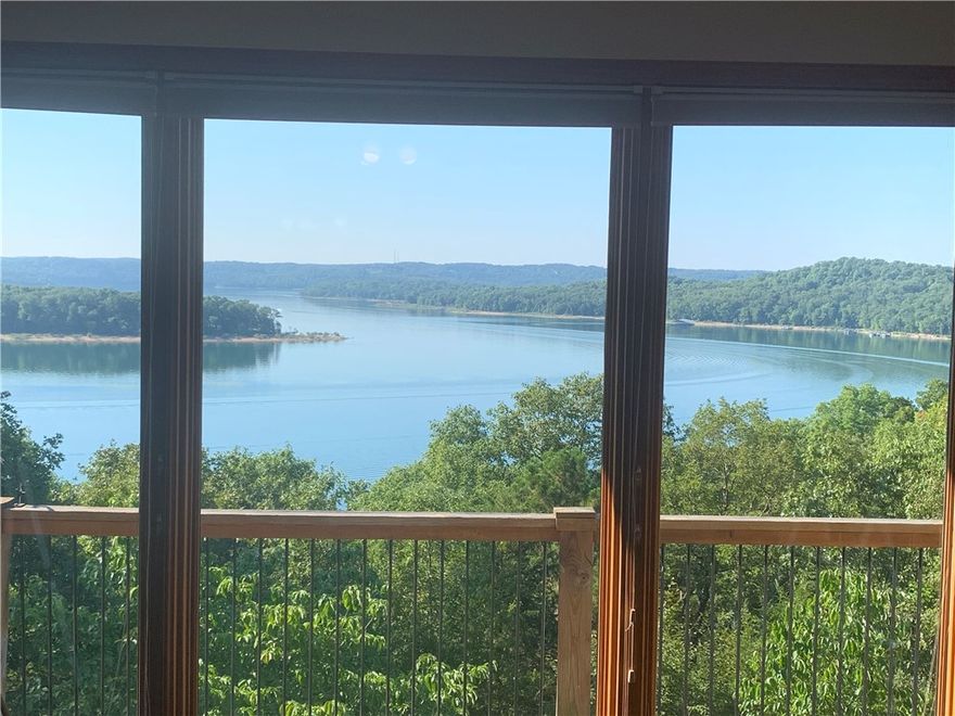 This beautiful Beaver Lake home welcomes you in with stunning views of the lake from nearly every window. Nestled on 2.82 acres you will feel like you have a little slice of Heaven all to yourself. An Ozark Bluff Dwellers Cave is located on the property, an amazing adventure to explore. (See attachment) Enjoy sunsets on the deck or from the community dock with your own 10 x 24 slip, boat lift & community swim deck.
Inside you will find a kitchen with granite counter tops, lots of cabinets and spacious pantry for storage. Lovely tile fireplace in living room with windows showcasing those gorgeous lake views. Owners suite with private access to the hot tub on the deck, ensuite bath, and walk in closet. Second bedroom and half bath complete the main floor. Basement level family room includes a wet bar, fireplace and lots of family fun. Large bedroom, full bath. Unfinished bonus room could easily be finished for a 4th bedroom.  Large storage area finishes the basement level.
Get ready to start living the "Lake Life".