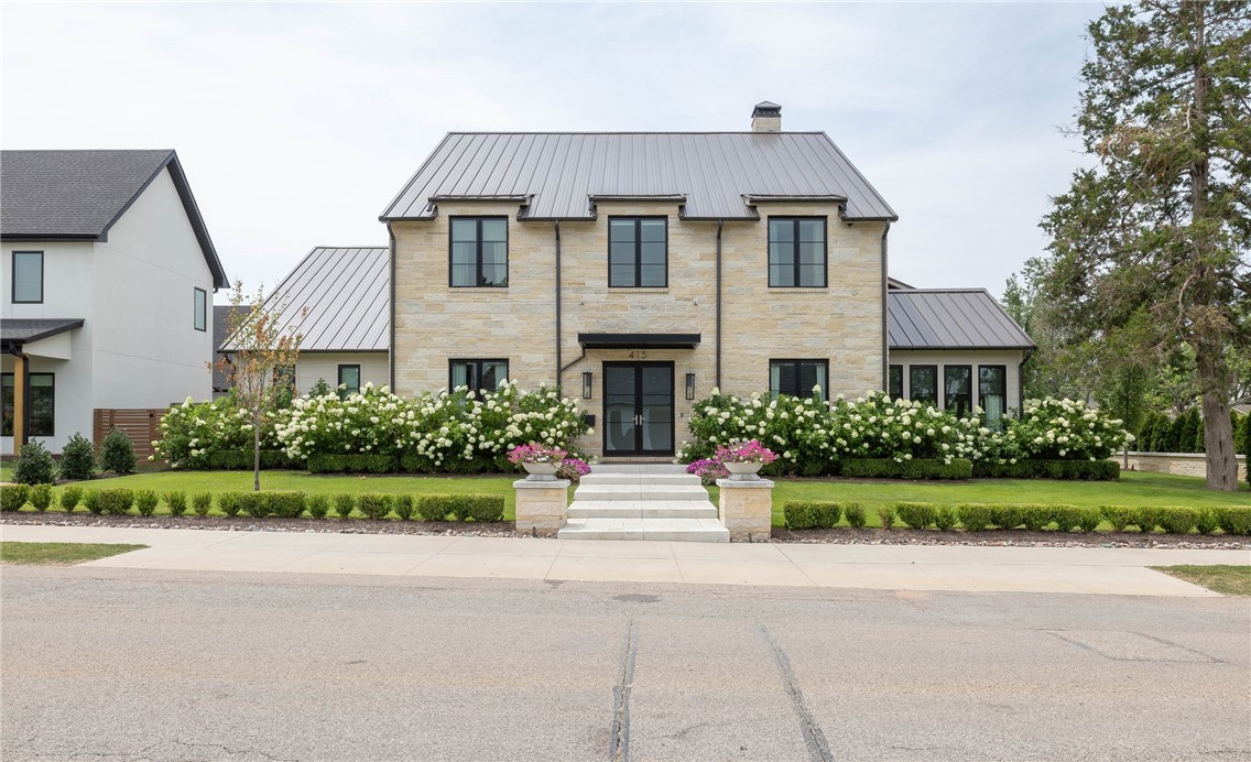 Unbelievable CUSTOM home in Downtown Bentonville corridor! 5,116 heated and cooled sq ft offers 4 bedrooms, 4 full bathrooms, 1 half bathroom, a Great room that is open to the dining and eat in kitchen, study, music room, butler’s pantry, bar, and a laundry room w/ dog washing station. Don't miss the 632 sq ft of under roof outdoor living situated between 2 screened in patrons with flush mounted ceiling heaters for year round comfort. Amenities include real white oak hardwood floors, 20’ ceiling in GR, Built in Subzero refrigerator, wine refrigerator with beverage drawers, Scotsman ice maker, Wolf gas range w/ griddle, Wolf double ovens, floor to ceiling black casement windows, Philip Jeffries wallpaper, and incredible landscaping package! The 3 car garage is oversized with built ins and an 11’ door on one side. This home is steps away from dining, shopping, entertainment and all things AWESOME that downtown Bentonville has to offer!!!!