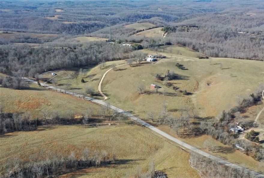 Nestled in the heart of the Ozarks, this 1,710 sq ft home crowns a scenic hill, offering sweeping, views of the surrounding landscapes and a true sense of peace, privacy, and serenity. Designed for comfortable country living, the home features 2 bedrooms, 2.5 bathrooms, and a 2-car attached garage. The exterior combines low-maintenance vinyl siding with a durable metal roof, while the interior boasts an open-concept living, dining, and kitchen area. Durable tile flooring and classic oak cabinetry provide a warm, inviting, and highly functional space, perfect for daily living or entertaining guests. With fiber internet avaliable, you can stay connected while enjoying the serenity of rural living. Also making it easy for remote work or virtual learning.