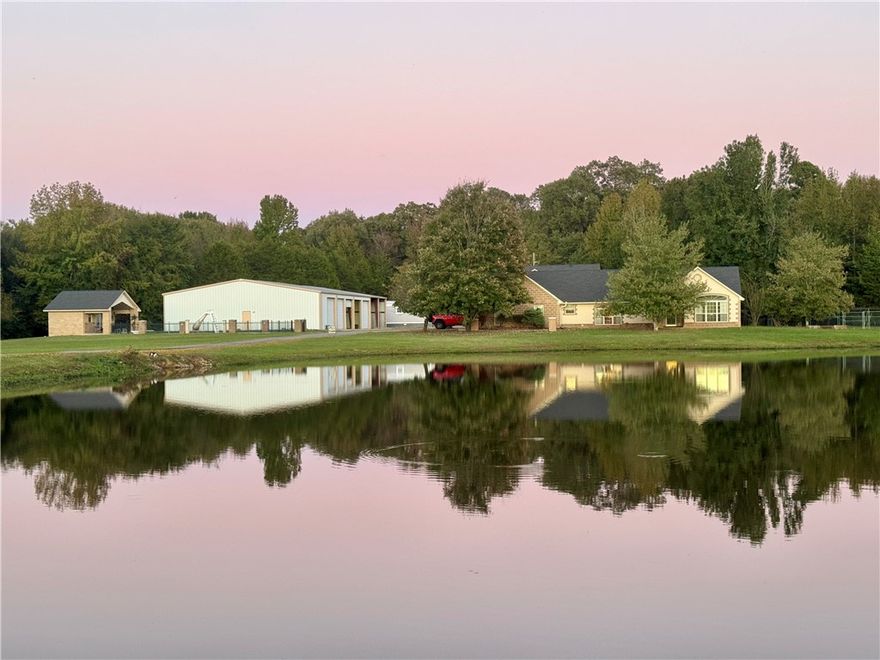 Back on buyers’ radar, new photos, refreshed price, and updated info. Located in the Pottsville School District, this property truly has it all: a Custom brick home, a 4,800 sq. ft. commercial shop, a guesthouse, an in-ground pool, & 10+/- acres! The main home offers 2,745 sq. ft. with 3 bedrooms and 3 bathrooms, including two en-suites, a sun room, and a 2-car garage.. Connected by a covered breezeway, you’ll find a fully heated and cooled 4-car garage (1,152 sq. ft.) that doubles as a game room, complete with an upstairs 1,296 sq. ft. guesthouse or separate living quarters. Additional amenities include a 240 sq. ft. hobby room, a safe room, animal kennels, and plenty of storage for every need. 
Outdoors, relax by the private pond or entertain by the sparkling in-ground pool, complemented by a 480 sq. ft. pool house with a full bathroom. With its combination of luxury, functionality, and acreage, this property is a rare find. Schedule your private showing today to see it all in person!