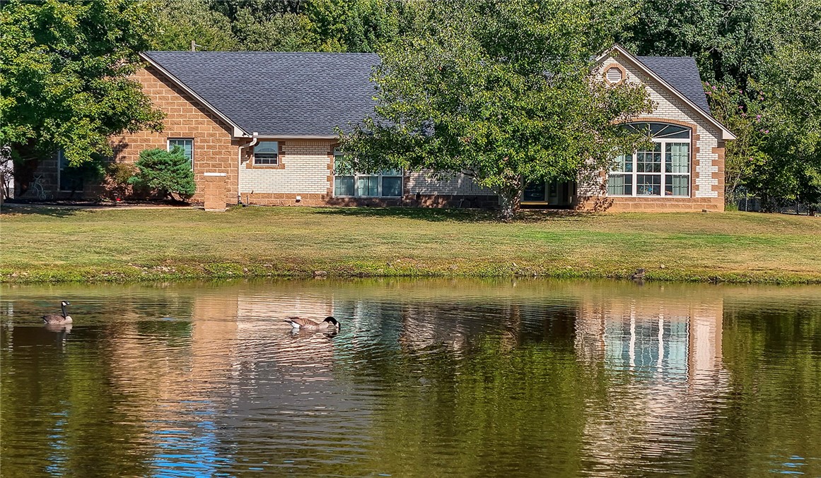 Located in the Pottsville School District, this property truly has it all: a Custom brick home, a 4,800 sq. ft. commercial shop, a guesthouse, an in-ground pool, & 10+/- acres! The main home offers 2,745 sq. ft. with 3 bedrooms and 3 bathrooms, including two en-suites, a sun room, and a 2-car garage.. Connected by a covered breezeway, you’ll find a fully heated and cooled 4-car garage (1,152 sq. ft.) that doubles as a game room, complete with an upstairs 1,296 sq. ft. guesthouse or separate living quarters. Additional amenities include a 240 sq. ft. hobby room, a safe room, animal kennels, and plenty of storage for every need.
Outdoors, relax by the private pond or entertain by the sparkling in-ground pool, complemented by a 480 sq. ft. pool house with a full bathroom. With its combination of luxury, functionality, and acreage, this property is a rare find. Schedule your private showing today to see it all in person!
