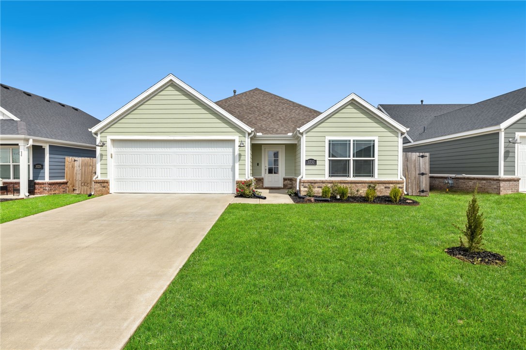 Charming home in Habberton Ridge Subdivision that checks all the boxes! Great location, great condition, great floorplan, great price...check! You will feel instantly at home when you see this cheerful home & all its curb appeal. Upon entering the home you are greeted with a foyer into the spacious & open living room, dining room, and kitchen. The living room features a gas fireplace, LVP flooring, & an extra space off to the side that is currently being used as an office. The kitchen has a large island, granite counters, pantry, & all appliances convey. Second oversized pantry found in laundry room. The kitchen flows into the dining room that has glass doors out to the covered back patio. Large primary suite with a huge closet, vaulted ceilings with beams, & the bathroom has a separate soaking tub and shower. Gorgeous modern fixtures throughout really elevate this home! Convenient location in Springdale close to the Don Tyson School of Innovation & Park featuring a splash pad, dog park, and many other amenities!