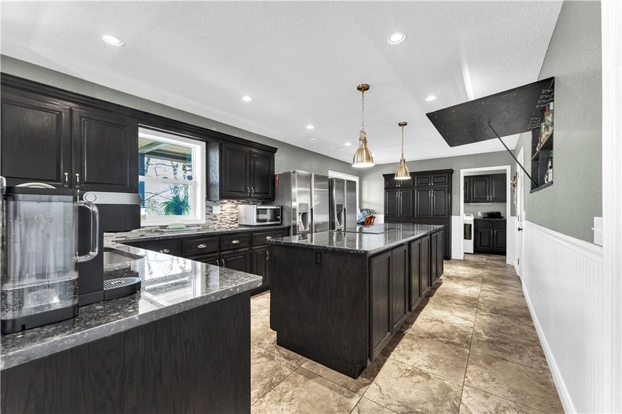 Step into summer with this completely updated gem just 5 minutes from I-49 and only 3 minutes to Lake Windsor’s public boat launch! Includes 2 refrigerators 2 televisions plus a washer and dryer! 
Walking distance to the community center and next to both walking/mountain biking trails! Inside, enjoy a fully renovated interior with wood-look tile, fresh paint, and plush 2025 carpeting in bedrooms. The kitchen stuns with Black Pearl granite, soft lighting, custom built-ins—including a hidden wet bar—and  stainless steel refrigerators. Washer and dryer also convey! The master offers a 55" Samsung Frame TV, double walk-in closets, and a spa-like bath with rain shower. The living room features a cozy stone fireplace and includes an 82" Samsung QLED TV. Outside boasts a new roof, gutters, and deck has been refreshed, triple-wide driveway, and extra rear parking. The basement garage is a dream workshop—ideal for woodworking or automotive projects. Stylish, functional, and move-in ready—your summer upgrade starts here!