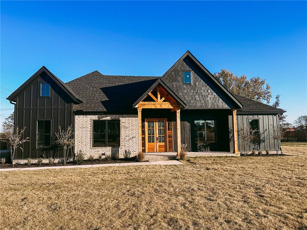 This is the one you've been waiting for, because We've made sure all of the boxes are checked! This stunning modern farmhouse sits on 1.01 level cleared acres in Bentonville School District. It is centered around outdoor living with an impressive outdoor kitchen and fireplace. Once inside, you'll be pleased to notice the attention to detail and find that the upgrades persist in revealing themselves. From 10' and higher ceilings throughout the main level, 8' doors, custom cabinets with white oak features, large format tile accent walls, quartz countertops, custom showers, the linear fireplace, and custom tile work it may be easy to overlook the double oven, built in ice maker, pot filler, microwave drawer, farm sink, led mirrors, underground storm shelter, insulated garage with epoxy floors and ultra quiet openers, and so much more. These are a few of the features you will find in this home and the other available homes in Wynnbrooke Estates! The pictured pool is a 35' Pinnacle pool by Leisure Pools.