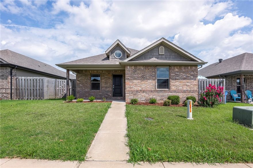 Welcome home! 2019 well maintained and like brand new home in a desirable location. Within walking distance of schools. Minutes away from downtown Bentonville, trail system, shopping, and I540 for easy daily commute. Home features; 3 Bedrooms, 2 Bathrooms, split floor plan, Utility Room, 2 car garage, & patio off side of home. Living Room with vaulted ceiling and open floor plan. Eat-in kitchen features granite counter tops, double stainless sink, & pantry. Primary suite features vanity w/ full mirror and enormous walk-in closet. Vinyl & brick maintenance free exterior. Excellent potential for long- or short-term rental.