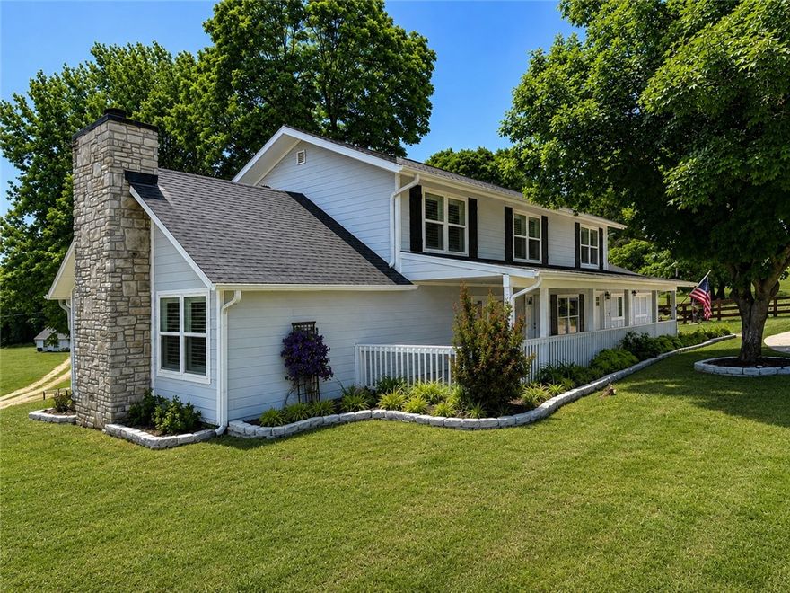 Updated 4BR/3BA authentic farmhouse on 5.04 acres in prime West Springdale! This 2,672 SF home blends modern comfort with timeless charm and is perfectly set up for a hobby farm or horse property. Features include a 1,488 SF shop with 3 bay doors and a heated/cooled office or man cave, plus a barn with loft, 1 powered bay door, tack room, and horse stalls. Property is fenced and cross-fenced with a 3-rail wooden horse pasture. Located off Old Hwy 68 on a quiet county road—just minutes from town. The new 612 Bypass (opening soon) will provide access in under 5 minutes. A rare opportunity to enjoy land, lifestyle, and location in one incredible property! AGENT OWNED.