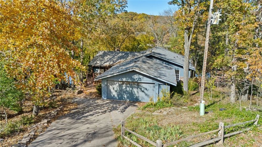 Create new memories with this one-owner house and private swim dock on Lake Windsor. The home is spacious, featuring a large wrap around deck with wonderful views of the lake. Butcher block counters in the kitchen with an additional sink, and a shop area leads into the garage with separate entry from the driveway. You will find an abundance of space in the lower level with walk out to the swim dock. Wood burning fireplace in the main living area and bonus living area downstairs that includes a sink/bar area.  A separate study area with built ins and lake views, propane wall heater for chilly nights. In ground propane tank to back up the heat pump. And yet another workshop area is just off the lower bonus room. Walk out to the lake and enjoy the sunset on your covered dock.