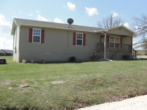 Nearly new 3 BR home in the county sitting on 1 acre surrounded mostly by farms. New 16 x 16 deck on back with nice view. All laminate floors.