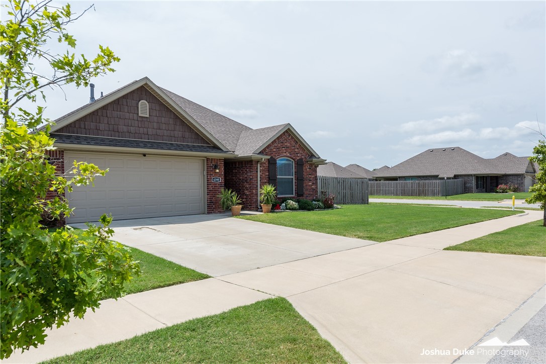 Beautiful, well kept, almost new brick home on a fenced in corner lot. Cozy up by the gas fireplace or enjoy a nice morning coffee on the covered back patio Your new home on Wales has lovely dark hard wood floors, a farmhouse kitchen sink, granite countertops throughout, and an oversized backyard for all the activities.