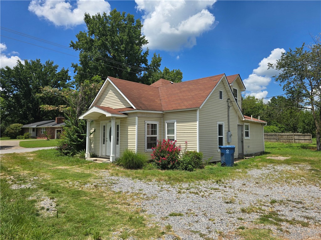 Your next project awaits on a 4.01-acre corner lot in the growing city of Gentry! Whether you are looking to maintain it as a residential property, remodel it for a business office, or develop it for commercial use, the possibilities are endless!