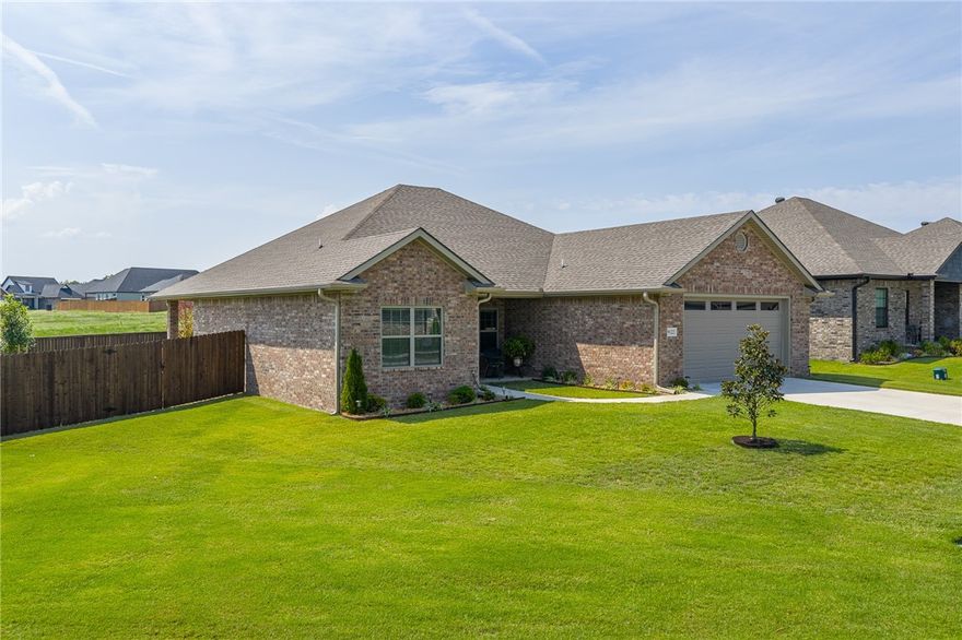 From the moment you step inside, you're greeted with beautiful engineered hardwood floors and a bright, open living space. This stunning 3 Bedroom 2 Bath home feels brand new and has been kept immaculately. The primary suite is a true retreat, featuring a striking barn door that leads to a spacious bathroom with a large, tiled walk-in-shower. The kitchen is designed for both everyday living and entertaining with a generous granite island perfect for serving food, enjoying casual meals, or gathering with friends.  A large walk-in pantry ensures you'll never run out of storage space, while the conveniently located laundry room off of the kitchen makes multi-tasking a breeze. After the day's work is done, unwind on the back porch and take in the spacious backyard; ideal for play, entertaining, or simply relaxing. This  home is move-in ready and waiting for you. Schedule your showing today or stop by the open house on Saturday from 11-1.Tour the home, watch the Hogs game and take your best shot at predicting the score.