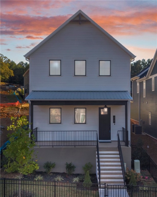 Your rare opportunity to call Stage Station home has arrived! This is the only single family home currently available in the neighborhood, and similar homes in Phase Two won’t be ready until Winter 2026. Less than one year old, this beautiful home is located just steps from the brand-new Confident Café, within walking distance of Butterfield Trail Elementary, & only minutes from Whole Foods, I-49, & downtown Fayetteville: you’ll love this highly sought-after location! Inside, you’ll find a thoughtfully-designed layout featuring three bedrooms, including a desirable first-floor Primary Suite. The open-concept kitchen, dining, and living area boasts soaring two-story ceilings and abundant natural light. Upstairs, you’ll find two additional bedrooms, a full bath, built-in desks, and a versatile Library/Bonus Space. Enjoy the outdoors with a fenced yard, and take advantage of the two-car garage for added storage and convenience. Homes like this don’t come along often in Stage Station—schedule your showing today!