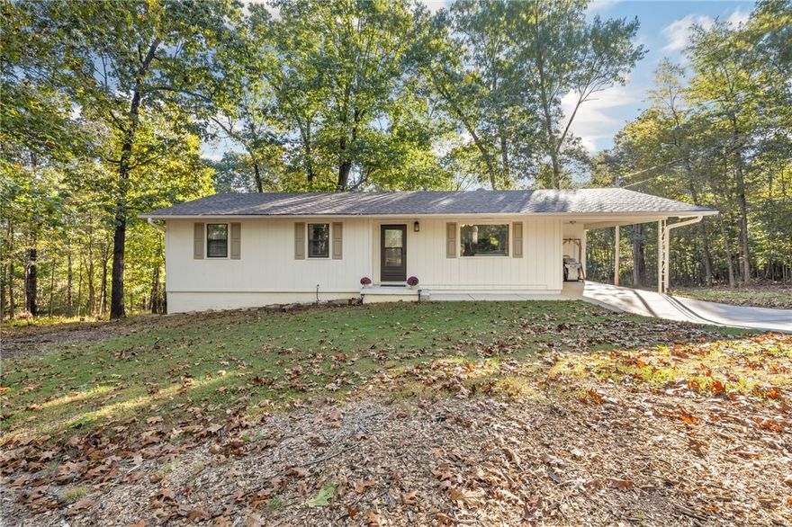 Beautifully maintained home situated on a large lot! Enjoy outdoor living on the spacious deck overlooking the yard. Recent updates include a new roof, septic system and  a freshly painted exterior in 2023. The home features a walkout basement, providing additional living space and lots of storage options! Washer/Dryer connections are available upstairs and downstairs, and an exterior RV connection adds extra convenience! Located just minutes from Lake Wedington with access to camping, hiking/biking. Highly likely you will see deer on the regular! If you are looking for peaceful living, this will be the one for you!