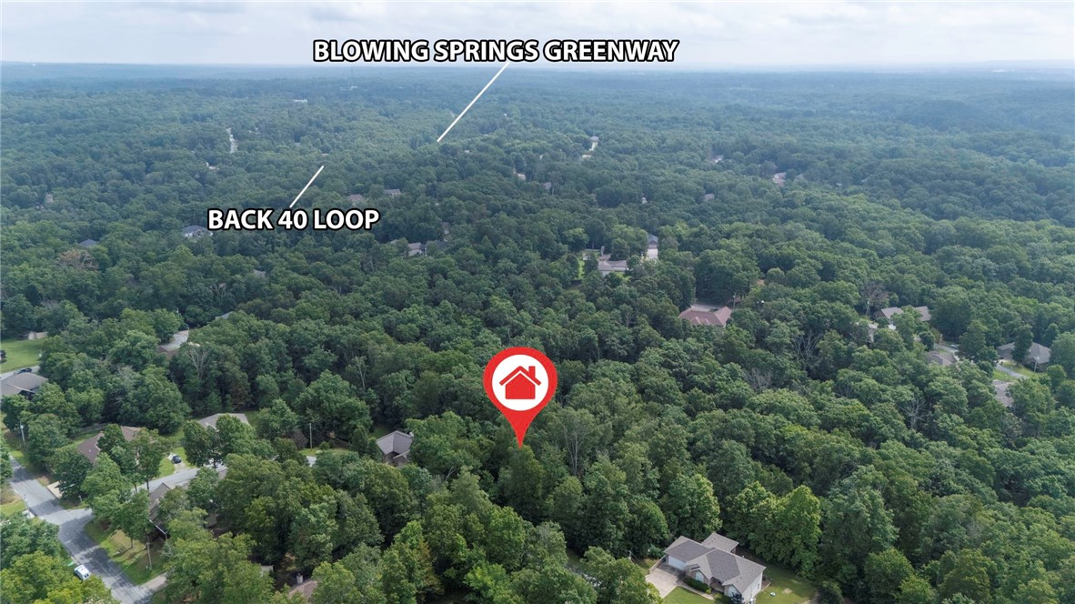 Discover your dream location! Nestled on a stunning .27-acre lot, this inviting property is just a quick 14-minute drive from the vibrant heart of downtown Bentonville. Enjoy nature at its finest with the Blowing Springs Greenway only 2 minutes away, perfect for leisurely strolls or active adventures. With seamless access to I-49, you're well-connected to all the amenities and attractions the area has to offer. Plus, you'll appreciate the generous green space on the left side of the lot—ideal for outdoor gatherings, gardens, or simply soaking in the beauty of your surroundings. Don’t miss this remarkable opportunity to build your future in such a desirable location!