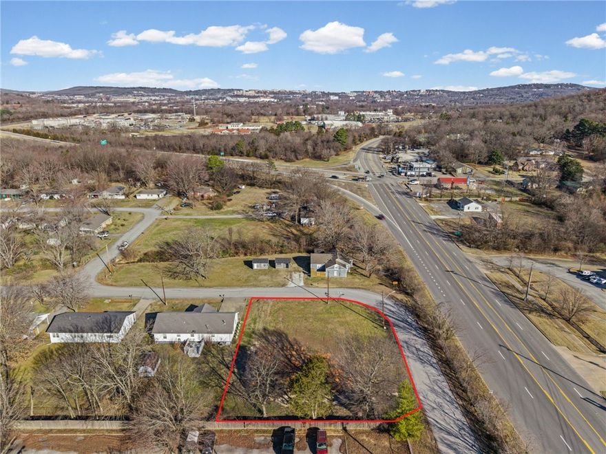 Build in one of Fayetteville’s most energetic and high-demand areas. This vacant corner lot is zoned Residential Multi-Family, making it ideal for investors, developers, or anyone seeking strong rental potential in the heart of Razorback country.

Set in an ideal locale near the 71B / I-49 junction, with easy access to the University of Arkansas, downtown, shopping, and dining. Enjoy game days just 2.5 miles from Baum-Walker Stadium, a short jaunt (under 4 miles) to Razorback Stadium and Bud Walton Arena, near the Randall Tyson Indoor Track Center, and a stone’s throw from Drake Field.

Bonus: All utilities available at the lot.

Surrounded by growth, year-round events, and strong rental demand, this location blends convenience, lifestyle, and investment opportunity.