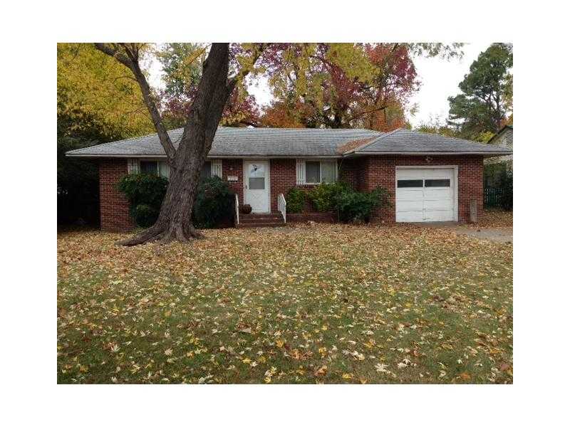 in the process of installing new carpet and painting interior!!! Walk to PARK, POOL, & LIBRARY! Cute 3 bedroom home with Large-plank wood floors in kitchen & living room. Huge tree covered, fenced back yard.