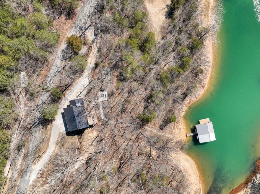 Move into this recently renovated Beaver Lake front home and start enjoying life! No need to fix or rebuild things because it’s already been done! This amazing home has everything you need to have fun at the lake including a two-slip private boat dock! Relax on the upper deck in the sunshine, or the lower deck in the hot tub, or around the firepit, ALL with a view of the lake! All surfaces inside and out have been refinished, rebuilt, or replaced. The house has a feeling of calm and comfort that is very relaxing. The living room and kitchen are fully open to each other with a raised ceiling and large windows. Two bedrooms and a bath are upstairs, with the master bed/bath downstairs along with a bonus room and 3rd bath. A second living room downstairs let’s you and your guests (or kids!) have some space. This subdivision has its own boat ramp for easy launching, the walk to the dock is short, and a huge cliff across the street is an amazing back drop! An excellent location on paved roads near Beaver Dam tops it off!