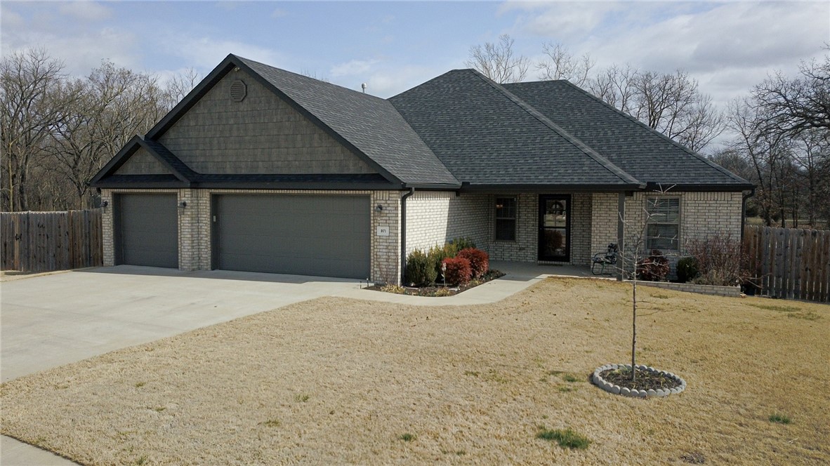 hard to find, 3car garage on .4 acre lot. brand new 24x30 shop building has overhead door/concrete floor. owners added a new deck that is mostly covered. wood grain tile floors throughout. also. new gas log, programmable recirculating pump, and keyless front door lock. large laundry room is connected to huge master closet. large kitchen has gas cooktop, granite, lots of cabinets, pull out spice racks and walk in pantry. master suite has tiled shower and whirlpool tub..attic storage,coat closet,linen closet. no house behind