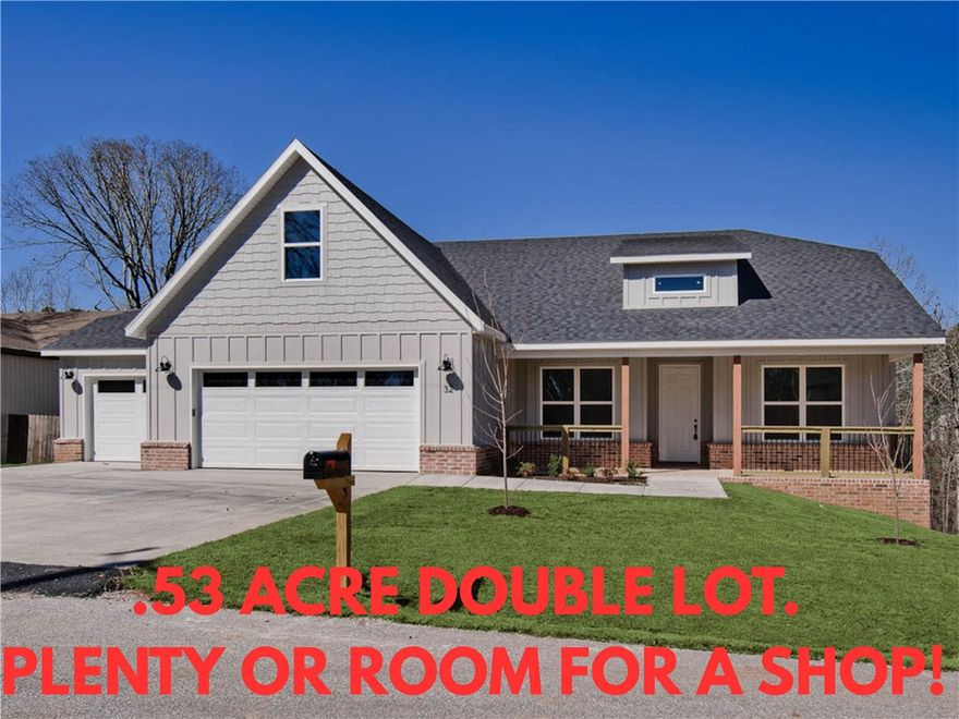 New construction on a .53 acre wooded double lot! Plenty of room for a shop. Located across the street from Scotsdale Golf Course and provides easy access to I-49 and Lake Loch Lomond. Features include a spacious 3-car garage, 3 bedrooms + upstairs bonus room with full bath. HARDWOOD FLOORS THROUGHOUT! (NO CARPET) The kitchen is equipped with a large island, 3 cm quartz counters, custom cabinets, stainless steel appliances, and a gas range. The living room boasts a beautiful fireplace, exposed beams, and a stunning cathedral ceiling. The primary bath features a luxurious soaking tub, separate vanities, and a huge walk-in closet with a custom tile shower. Custom finishes throughout. $3,500 in closing costs when using the builder's preferred local lender.