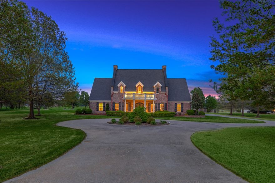 Stunning East Fayetteville Estate Home in The Vineyards. This 4 Bedroom home features a gorgeous foyer entry, formal dining space, open living area, large bonus & more. Immaculate details throughout, elegant crown molding, custom staircase railing imported from London, hardwood floors. Spacious & bright living area with gas fireplace. Kitchen features double islands, main and prep sink, two dishwashers, two pantries, a 6 burner Wolf Range, built-in fridge & warming drawer. Eat in space off kitchen. 3 car garage & laundry room accessible on main level & half bath for guests. A full guest suite on main level w/bathroom. Primary suite boasts a spa like attached bath, off the primary is a custom spa suite with fireplace & built in hot tub. Upstairs you will find an additional two guest beds, each with bath. Large bonus room upstairs. Covered patio with built in grill station provides outdoor living space. Enjoy serene setting while still being short distance to shopping, dining, entertainment.
