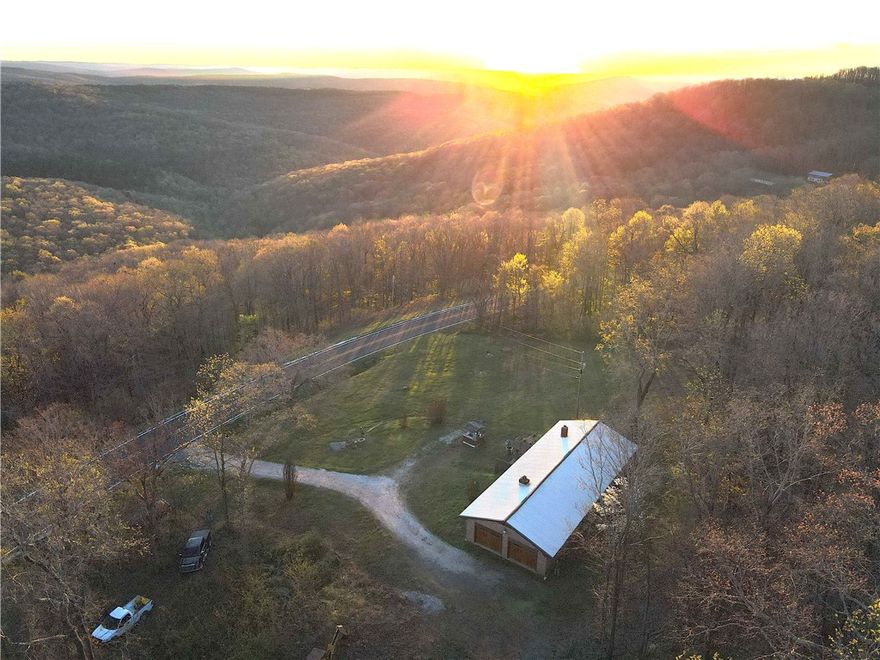 This charming 3 bed 1 bath brick home is nestled on approximately 8 acres with pavement
frontage bordering the National Forest providing the perfect backdrop for nature lovers. A
cleared area is already designated for a shop building that would add a great space for
hobbies and storage. The views from the home are nothing short of breathtaking, enhancing
the overall appeal of the property. Essential utilities are already on site including electric, rural
water, septic and fiber internet. There are additional build sites on the property that increase in
elevation adding even greater views. The home designed for comfort and sophistication offers
2 large bedrooms and 1 smaller bedroom. The kitchen features granite counter tops, an island
and beautiful handcrafted cabinetry. The main living space has windows that look out over
miles of the Ozark mountains where the abundant wildlife in the area can be observed.
With Forest boundary, pavement frontage and proximity to recreation this property is a box checker!