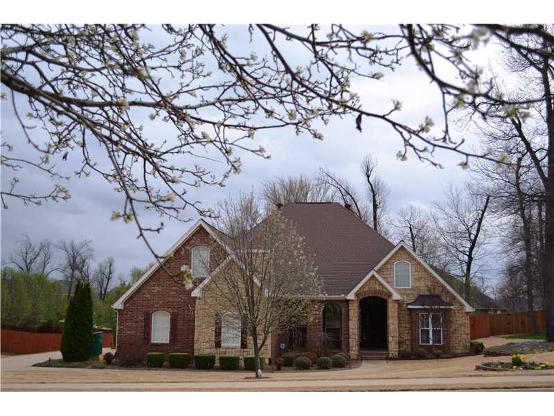 Fantastic home on more than a half acre- fully sprinkled & beautifully landscaped. Seller has enclosed porch for heated and cooled sunroom not included in square footage. Split bedroom plan with a bonus room upstairs (can be BR 5).,The gourmet kitchen opens to breakfast and sitting area. Hardwood flooring in kitchen area. Laundry room has been built to "safe room" specifications with re-enforced walls and door for protection from tornadoes.