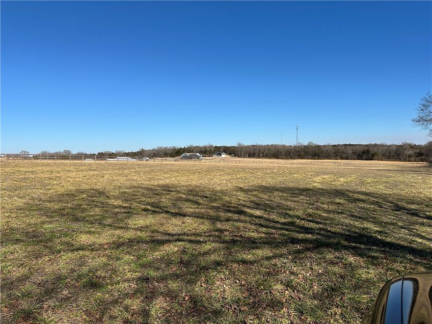 Discover the perfect blend of convenience and country charm with this beautiful 4-acre m/l tract just outside of town. This very level propertyoffers an exceptional building site, already perked for a three-bedroom home, making it truly build-ready. Utilities are in place with power, electric, and high-speed fiber available—ideal for modern living while enjoying a peaceful setting. The land is fenced on two sides and features a lushcovering of red clover, adding both beauty and natural appeal. Whether you’re planning a forever home, a hobby farm, or a quiet retreat close totown amenities, this property checks all the boxes. Rare opportunity for a clean, usable parcel with minimal prep needed—bring your plans andstart building your dream. Maybe put CALLING ALL BUILDERS or BUILD YOUR NEW HOME