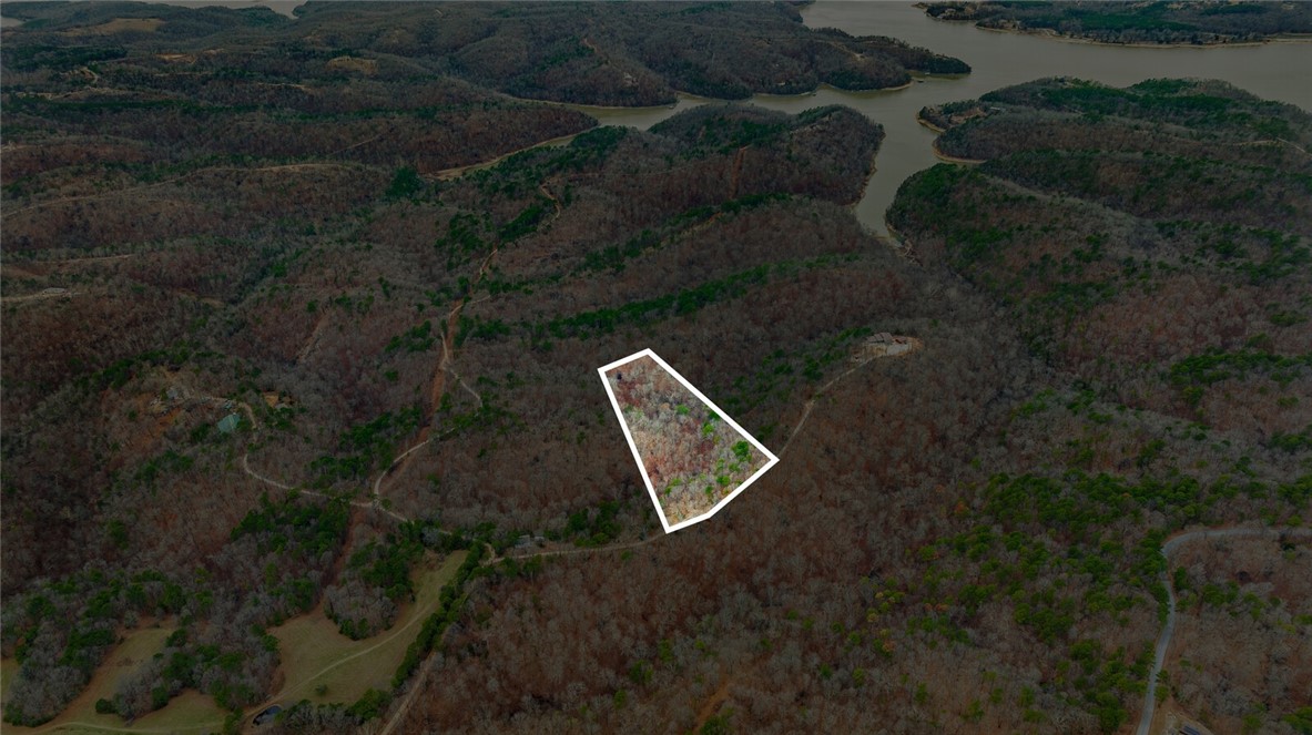 Discover the perfect canvas for your dream home with this stunning 5-acre tract in Emerald Bay subdivision. Boasting breathtaking views and endless potential, this property offers a serene retreat near the lake. While well water and septic are needed, electricity is already on-site, making your building process more convenient.
Located just minutes from the historic War Eagle Mill and a short drive to downtown Rogers, youāll enjoy the perfect balance of peaceful living and easy access to amenities. Whether youāre envisioning a custom home or a weekend getaway, this property provides the ideal setting to bring your vision to life. Donāt miss this rare opportunity to own a slice of Emerald Bay!