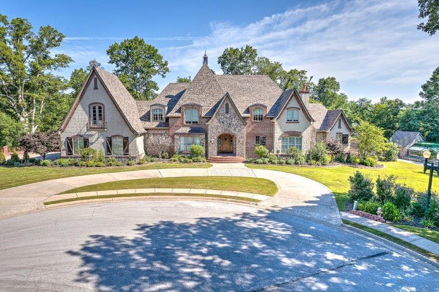 LUXURY ESTATE LIVING JUST 3 MILES FROM DOWNTOWN BENTONVILLE and minutes to trails, park and I-49!  This exquisite European-style home is nestled on a quiet cul-de-sac on 2.44 acres with private backyard oasis boasting multiple outdoor living spaces w/ outdoor fireplace, pool, detached 220 sq ft pool house/in-law suite w/ kitchen, bath and bedroom, plus a professional greenhouse with auto-watering system.  Exquisitely designed, this opulent home has been updated throughout with new roof, new AC unit, all new high end stainless appliances, new sprinkler system, phon¬e-controlled surround sound, garage doors, cinema system and pool equipment.  Luxurious interior offers all new paint & light fixtures.  Main level master w/ private living space w/ fireplace plus His and Her en suite baths and walk-in closets. Fabulous walk-out basement w/ kitchen, living area w/ fireplace, 2 beds, 2  baths, office w/ fireplace & bonus rm. Two additional lots are available for purchase in the cul-de-sac to create your own private oasis!