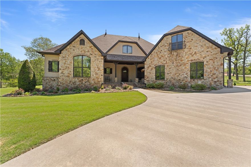 Nestled on a one-acre lot in highly sought-after East Fayetteville, this custom-built masterpiece offers guaranteed seclusion with a tranquil wet weather creek on one side and protected POA land across. Arrive via the paved circular drive to your oversized three-car garage before entering an arched foyer that opens into a stunning living space defined by 10-to-12-foot ceilings, crown molding, and a breathtaking fireplace. The chef’s kitchen is a triumph of efficiency and style, featuring luxury conveniences like a pot filler, spice cabinets, and custom corbels, while the formal dining room captivates with unique hand-sculpted walls. Every inch of this home—from the sturdy 6-inch exterior walls to the brand-new 2025 roof, gutters, and appliances—has been thoughtfully designed for longevity and elegance. Transition seamlessly to the ultimate entertainer’s backyard, where a landscaped paradise awaits with a wired-for-sound covered patio, an outdoor kitchen, and a rocked fire pit. Most contents of home are negotiable.