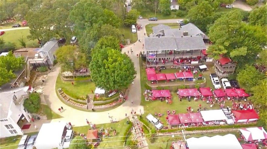 Directly across the street from the Donald W Reynolds Razorback football stadium, this iconic game-day destination is known & loved by all! Entire property consists of 3 residential dwellings, private heated pool, 2 lots beautifully-landscaped (yard is wired w/electric & cable), 3-car & huge RV garages, & even a 2-story treehouse equipped w/TV, electric, & WiFi, which is also rented out on game days! The number of bedrooms, bathrooms, kitchens, & living areas is simply mind-blowing. Included in the list price are TWO home businesses that convey with sale. Northwest Arkansas, ranked one of the Best Places to Live in America, is home to the nation’s 5th fastest growing city, university & professional sports teams, world-class Crystal Bridges Museum of American Art, more than 200 miles of mountain biking and paved trails, & headquarters for Walmart, Tyson Foods, & JB Hunt. Follow video link to see exciting game day business in action!