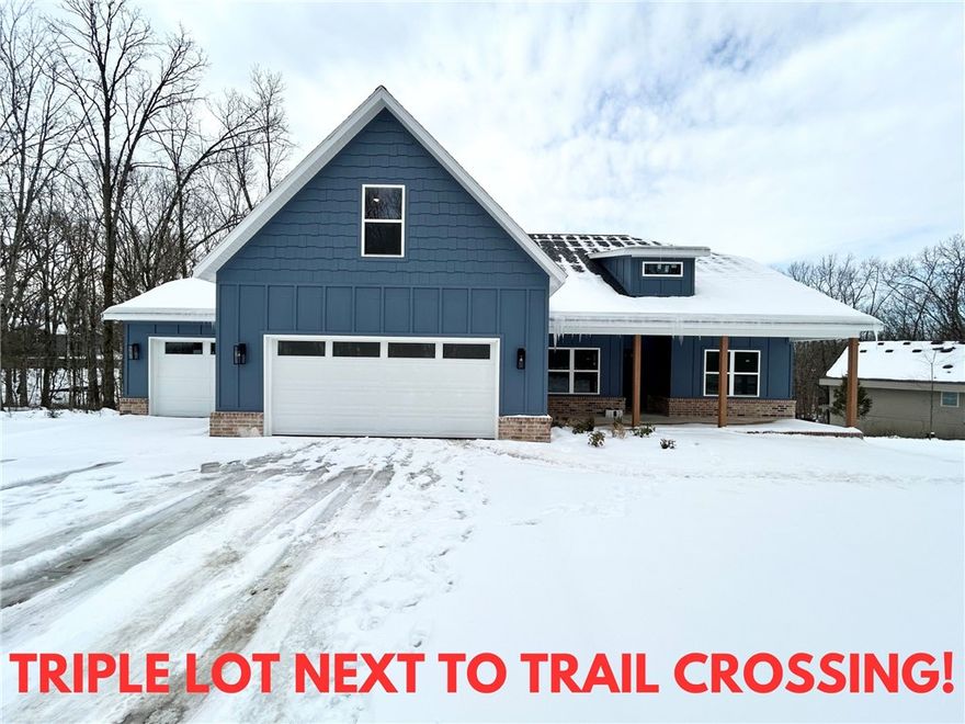 New construction on 3 wooded lots totaling .83 acres next to the Tunnel Vision Trail Crossing! Plenty of room for a shop or in-ground pool.  Located within very close proximity to Scotsdale Golf Course and Loch Lomond Marina! Features include a spacious 3-car garage, 3 bedrooms + upstairs bonus room with full bath which could also be utilized as an additional bedroom. The kitchen is equipped with a large island, 3 cm quartz counters, custom cabinets, stainless steel appliances, and a gas range. The living room boasts a beautiful fireplace, exposed beams, and a stunning cathedral ceiling. The primary bath features a luxurious soaking tub, separate vanities, and a huge walk-in closet with a custom tile shower. Custom finishes throughout. $3,500 in closing costs when using the builder's preferred local lender.