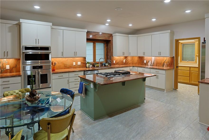 Motivated Seller! Welcome to 8985 Pikes Peak Road in Rogers — a beautifully maintained 4-bedroom, 3-bath home offering 3,507 sq ft on 1.66 acres(1941 sqft main level, 1566 sqft basement). Blending space, comfort, and versatility, this property offers a peaceful setting with convenient access to town. The kitchen is a true centerpiece, featuring Brazilian quartzite countertops, stainless steel appliances, a built-in wall oven with French doors, and a multifunction microwave that also serves as a convection oven and air fryer. Open living spaces create an inviting flow for everyday living and entertaining. The finished basement adds exceptional flexibility, ideal for a second living area, media room, game room, home gym, or guest retreat. Step outside and enjoy room to roam, privacy, and the beauty of Northwest Arkansas while remaining close to shopping, dining, and amenities. A rare combination of acreage, functionality, and style — this home is a must-see. 1% lender credit offered from preferred lender.